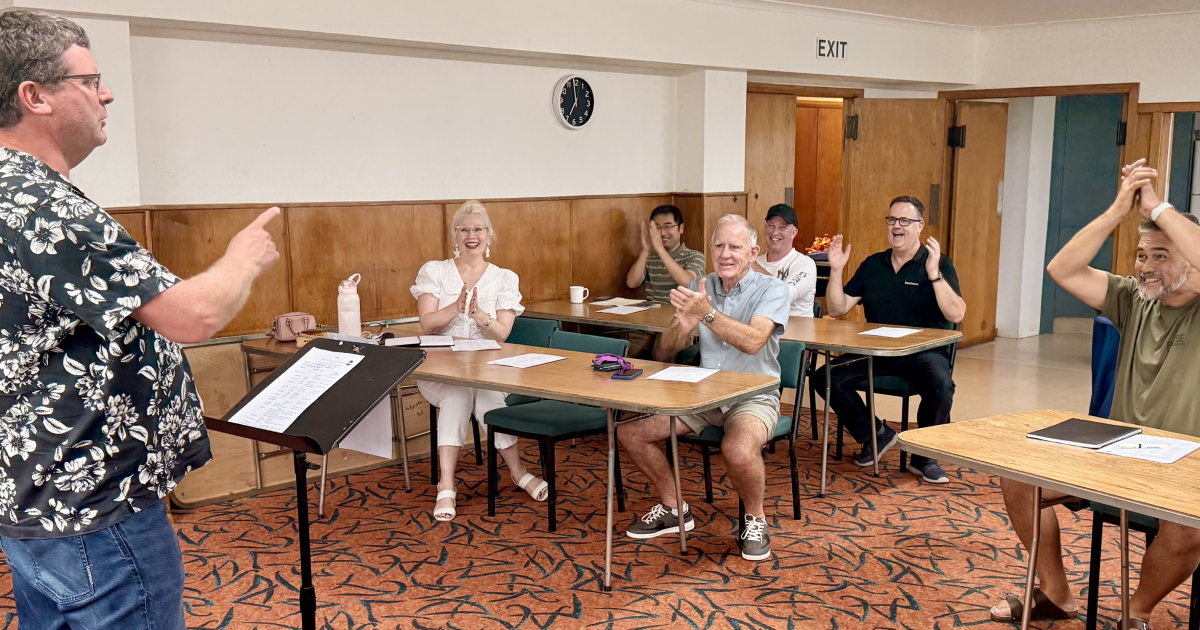Audience applauding a speaker at Karaka Toastmasters