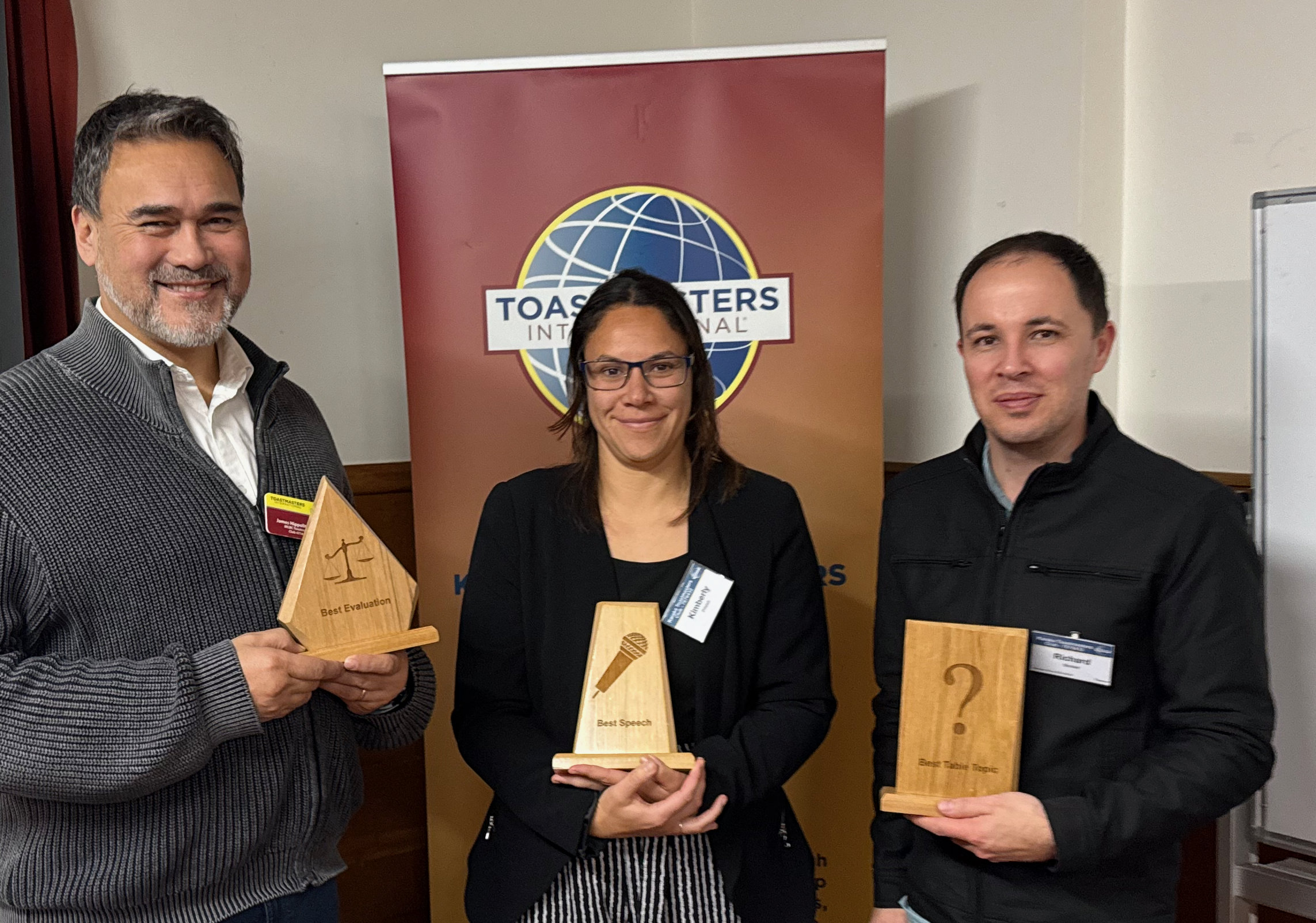 Karaka Toastmasters members posing with awards after a meeting
